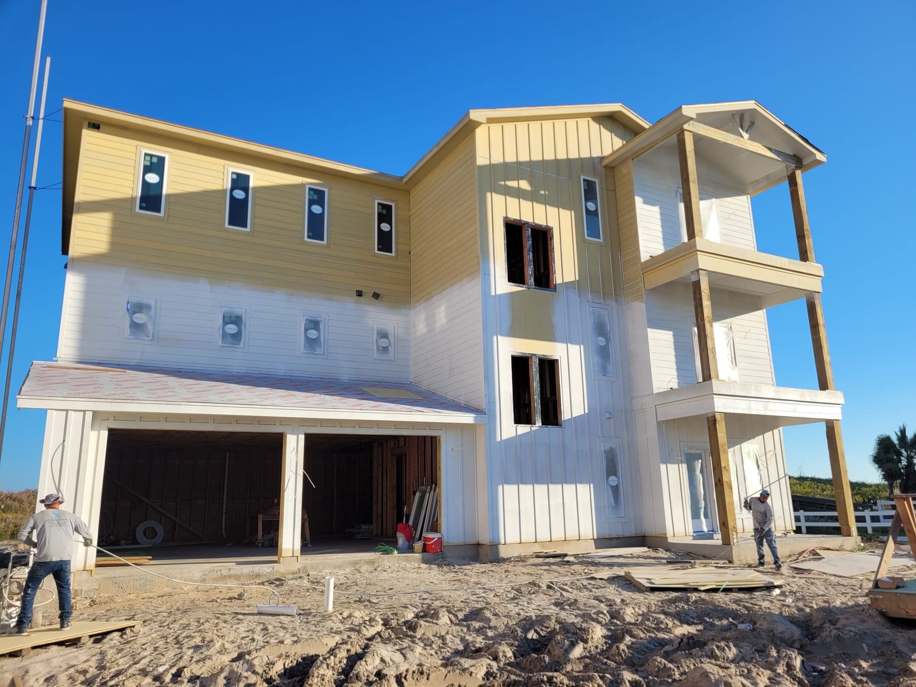 White Mediterranean-style coastal home under construction