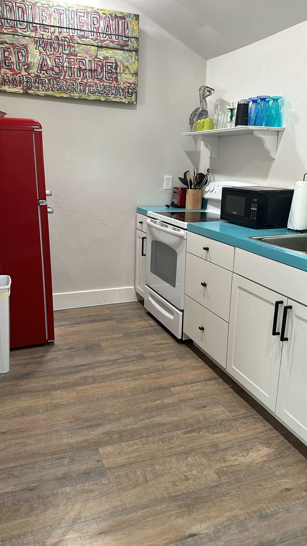 Colorful kitchen remodel with teal accents