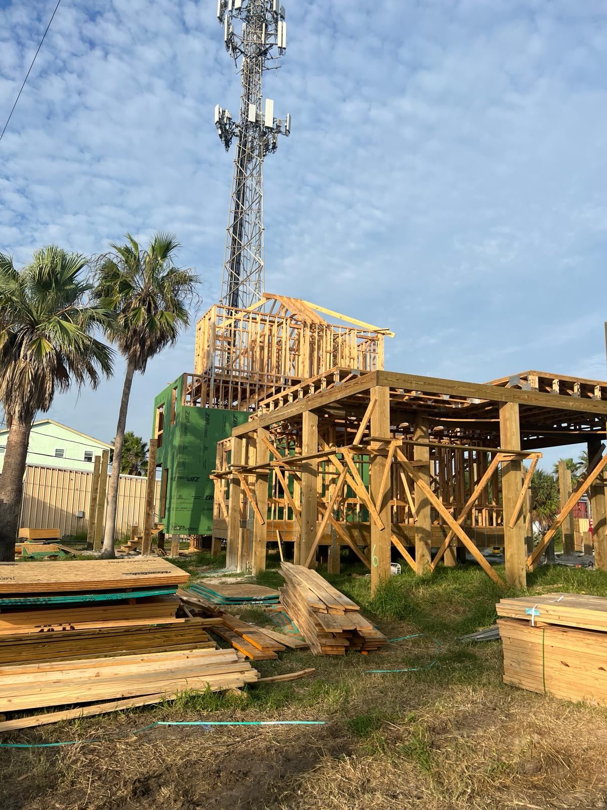 Coastal home framing with house wrap installed